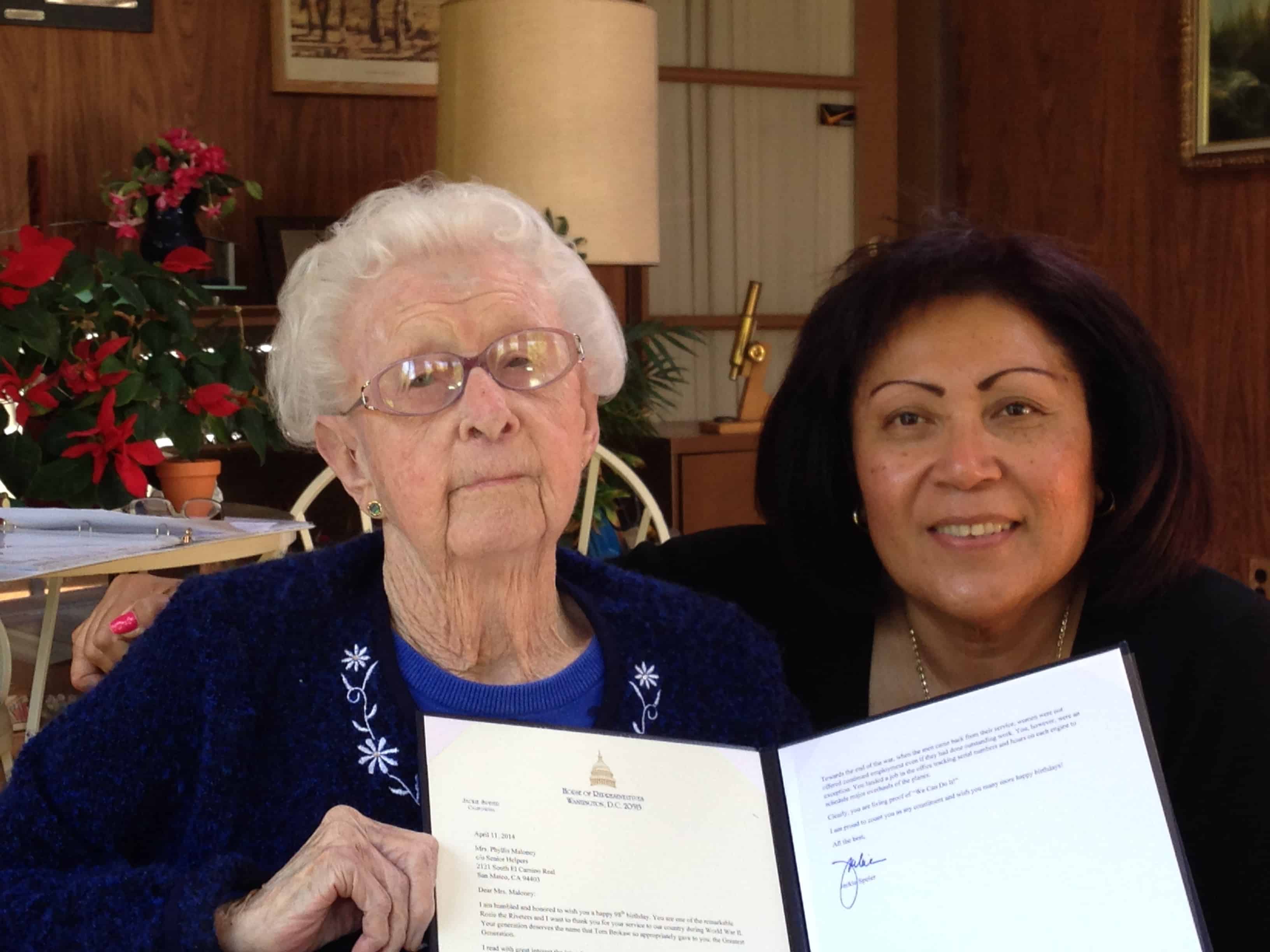 One of our clients, Phyllis, was recognized by our US representative to congress (Jackie Speier) for her work on airplanes during WWII. Phyllis is holding the official letter, on stationary from the US House of Representativesalong with her caregiver, Pafia.
