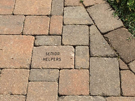 Senior Helpers makes a contribution to the Hospice House commemorated by a “Brick” on the Memorial Walkway