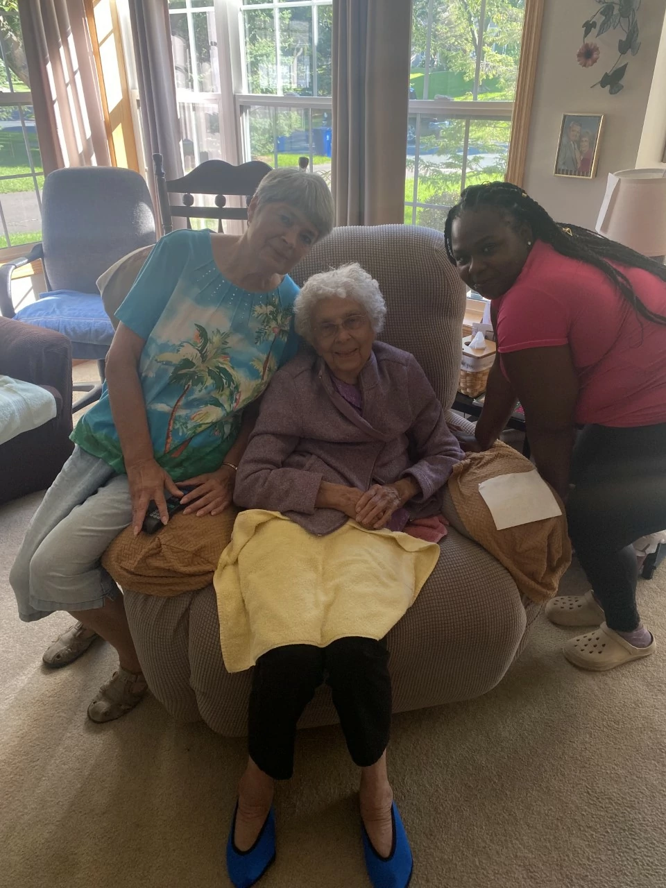 Here is a picture of our client, her daughter, and her caregiver. We had a wonderful visit and even brought treats. Tasha and Gladys love to watch tv shows and do crossword puzzles together!