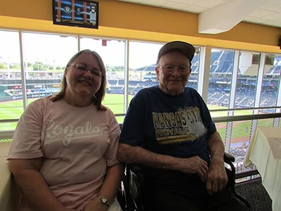 Our caregiver enjoying the big game with her client!