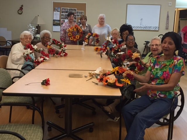Senior Helpers Westchester Wreath Making Event with Residents at Garito Manor at Union Square (New Rochelle)