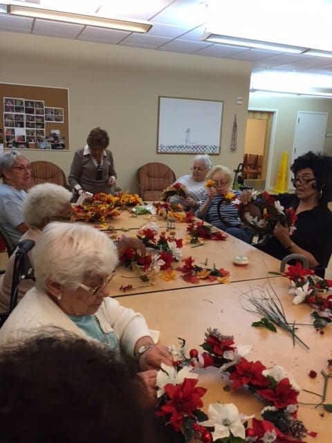 Senior Helpers Westchester Wreath Making Event with Residents at Garito Manor at Union Square (New Rochelle)