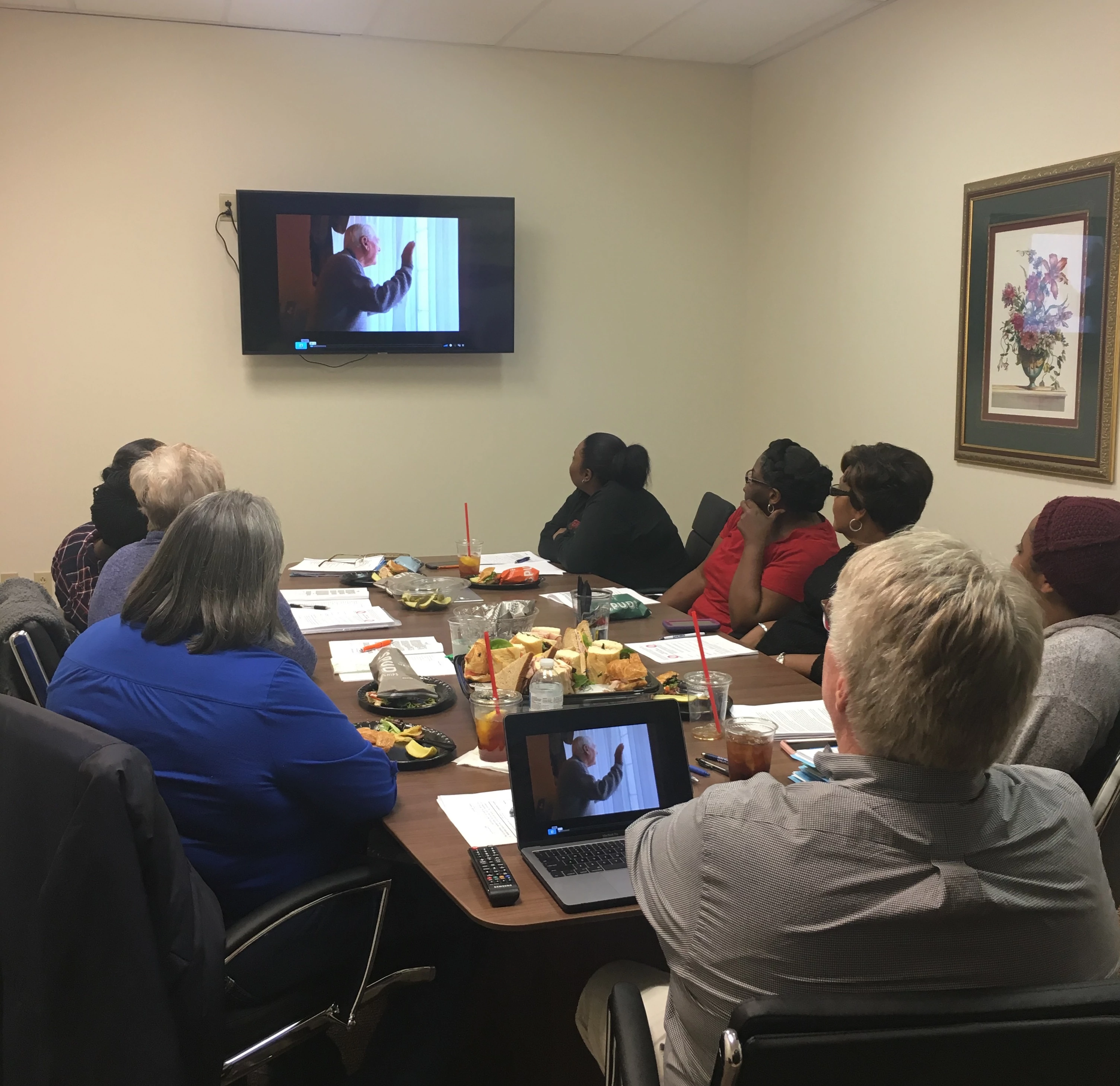 Owner Bill Bustin training a group of caregivers for in-home senior care