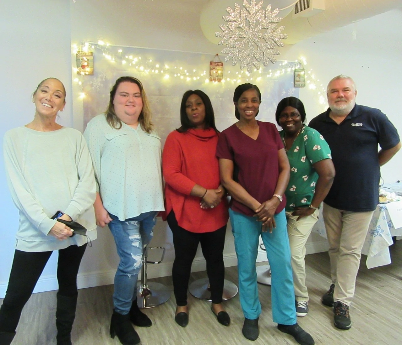 Group photo of caregivers and office staff at the Caregiver Holiday Event on December 17, 2021.
