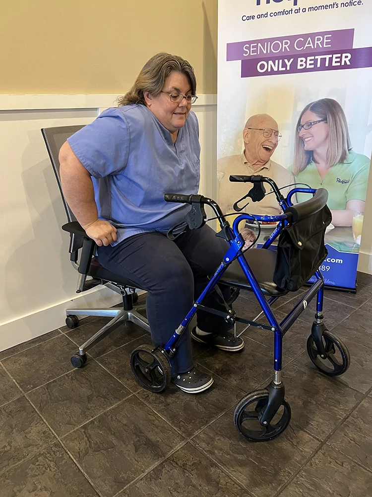 Lisa Blackburn (our nurse and a caregiver) demonstrating how a client can aid by activating strength (as part of skills training for caregivers)