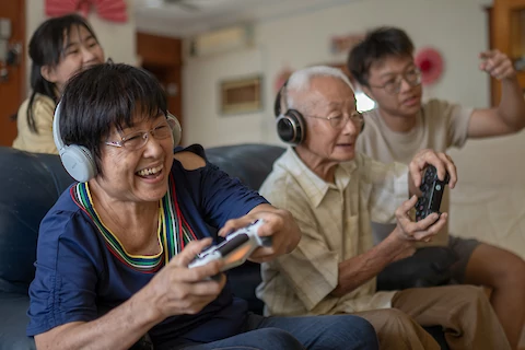 Elderly people with technology gadget, play video game. Seni