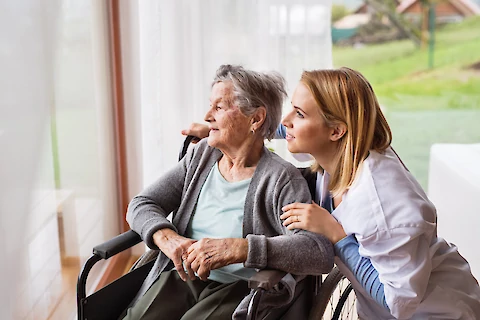 https://www.seniorhelpers.com/site/assets/files/390004/caregiver_talking_to_an_elderly_woman_in_a_wheelchair.480x0.webp