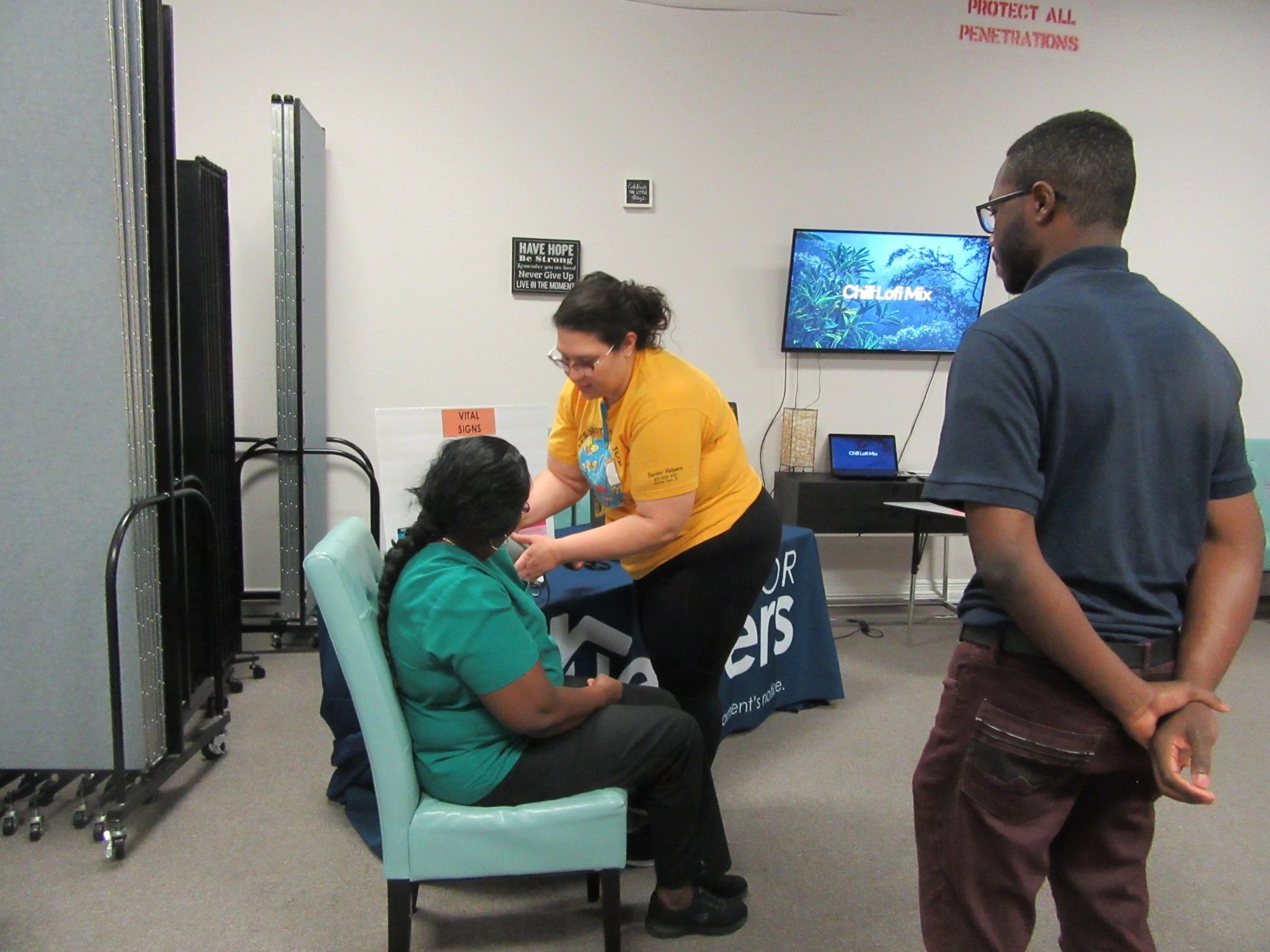 Caregivers review blood pressure skills with Director of Nursing.