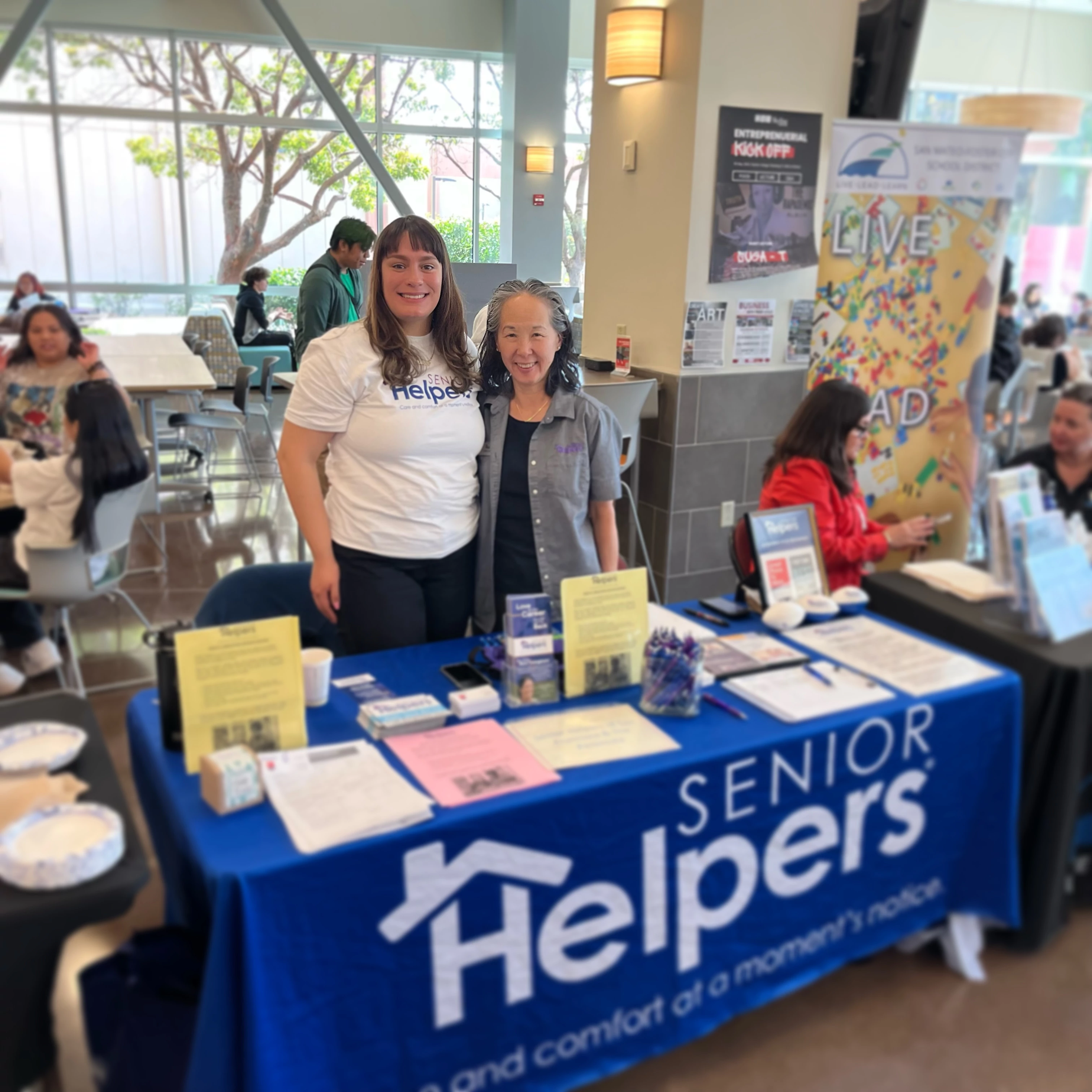 Carol Mori and Becky Gonzalez at a Job Fair for Skyline College. They are there to inspire the younger generation to choose a career in Senior Care.