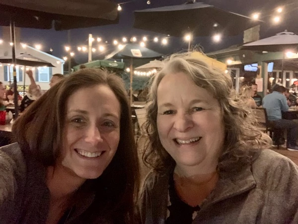Jean & Kaitlin enjoying a patio dinner with live music after day 1 of learning LIFE Profile to help create better care plans.