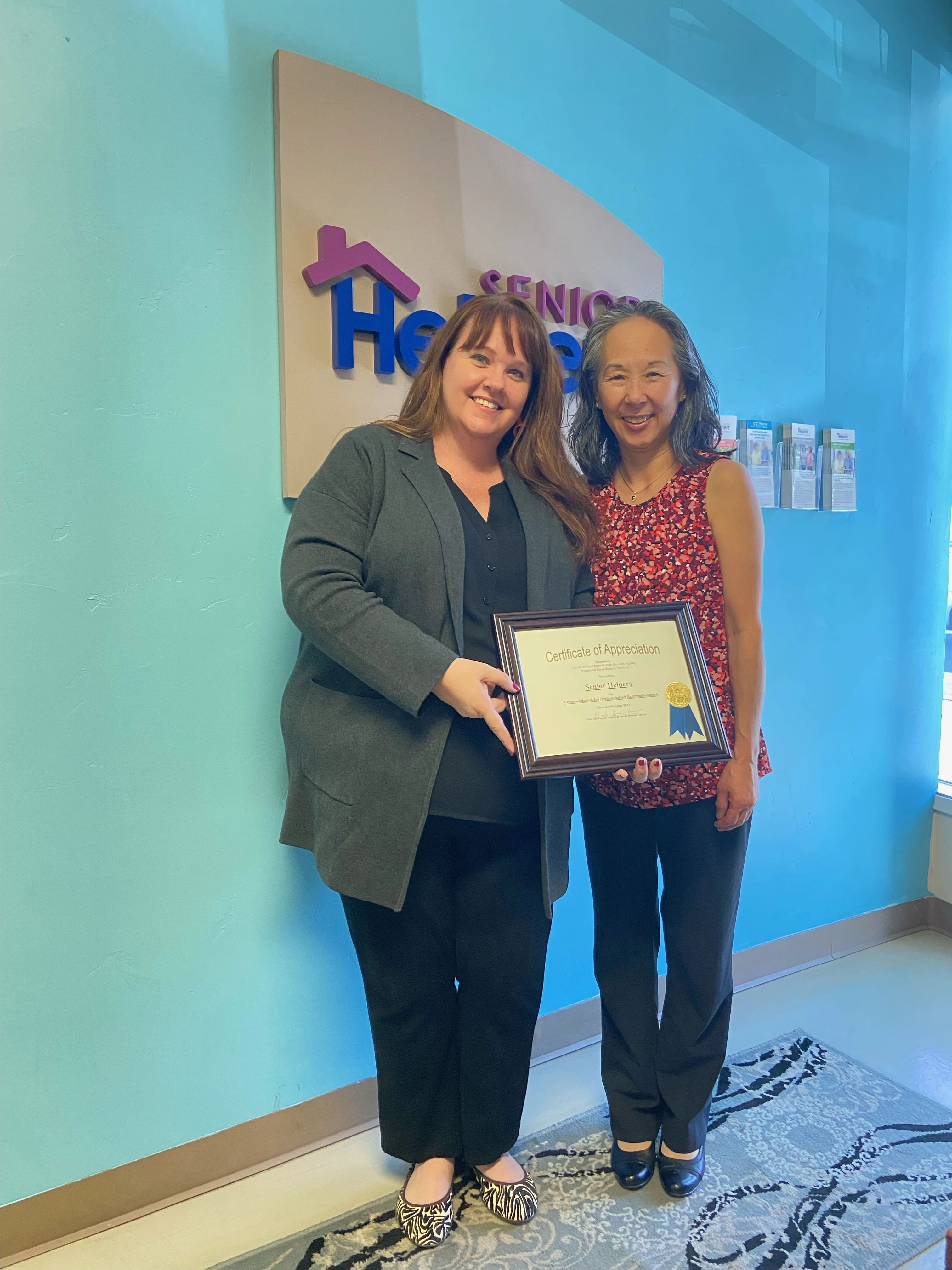 Kristina May presents Carol Mori (Caregiver Manager) the National Disability Employment Awareness Award. Carol works hard to find the right clients to place these employees with to make it a great fit for all.