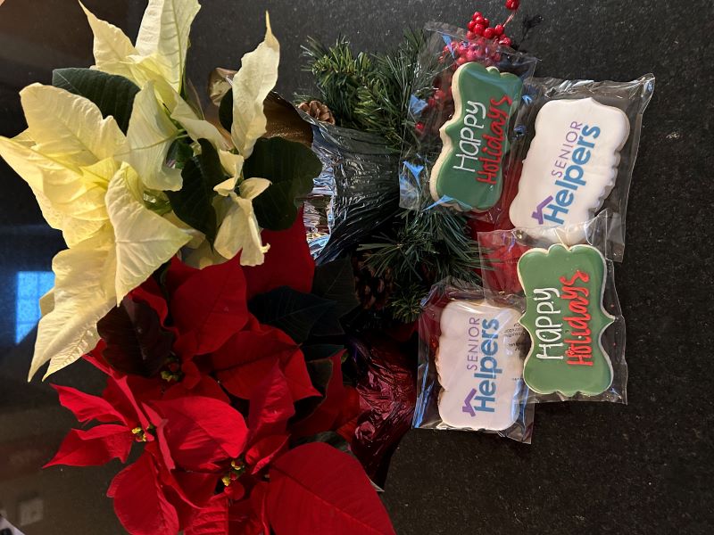 Happy Holidays from Senior Helpers Roseville! We brought over poinsettias and cookies to our clients and family’s.