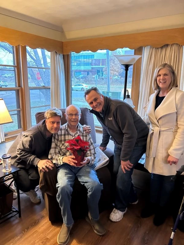Co-owners, Paul and Laurie stopped by to see William and his caregiver, Brendon. William loved his poinsettia!