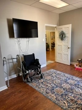 Lastly, in the living space, are everyday items such as a wheelchair, walker, TV along with fall risks such as loose wires and an area rug.