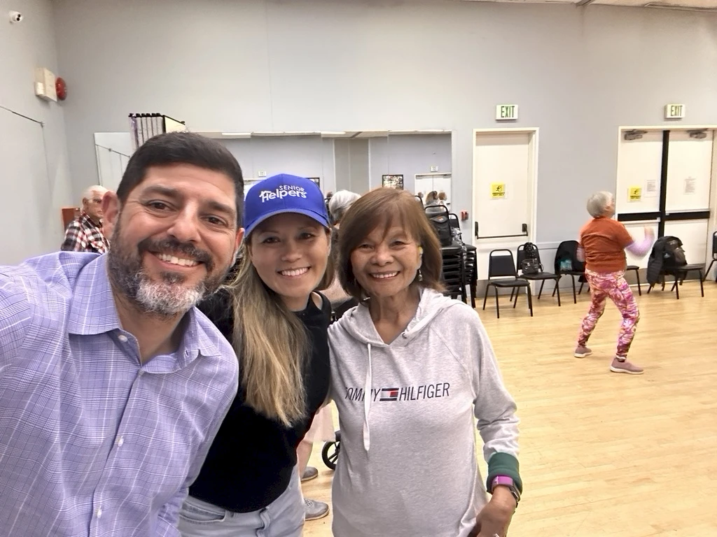 Owner, Slade Abisror and his wife, Geri, along with one of our seniors, enjoying a Zumba class at One Generation!