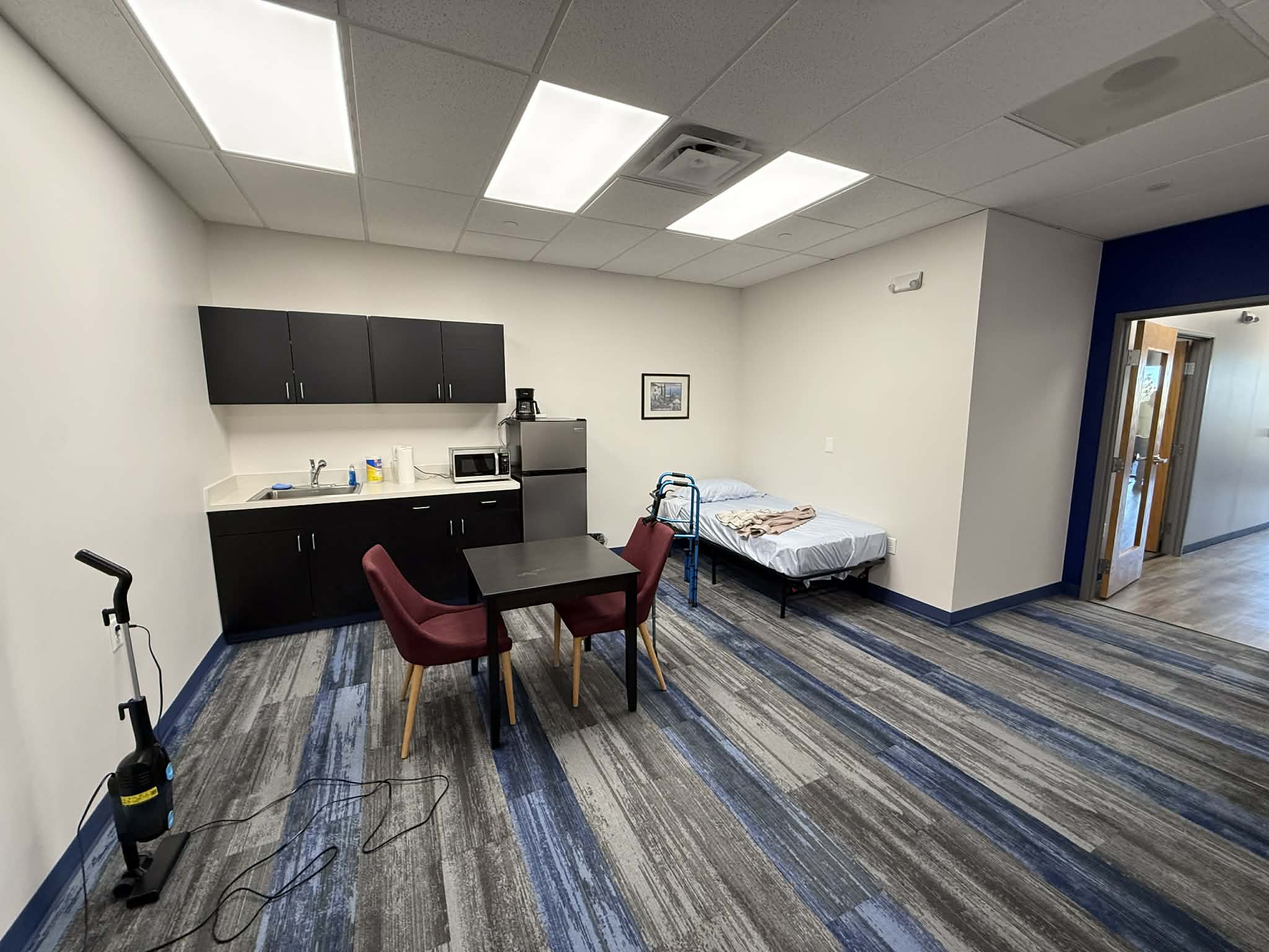 Wide view of the Kitchen and Bedroom areas of our COE.