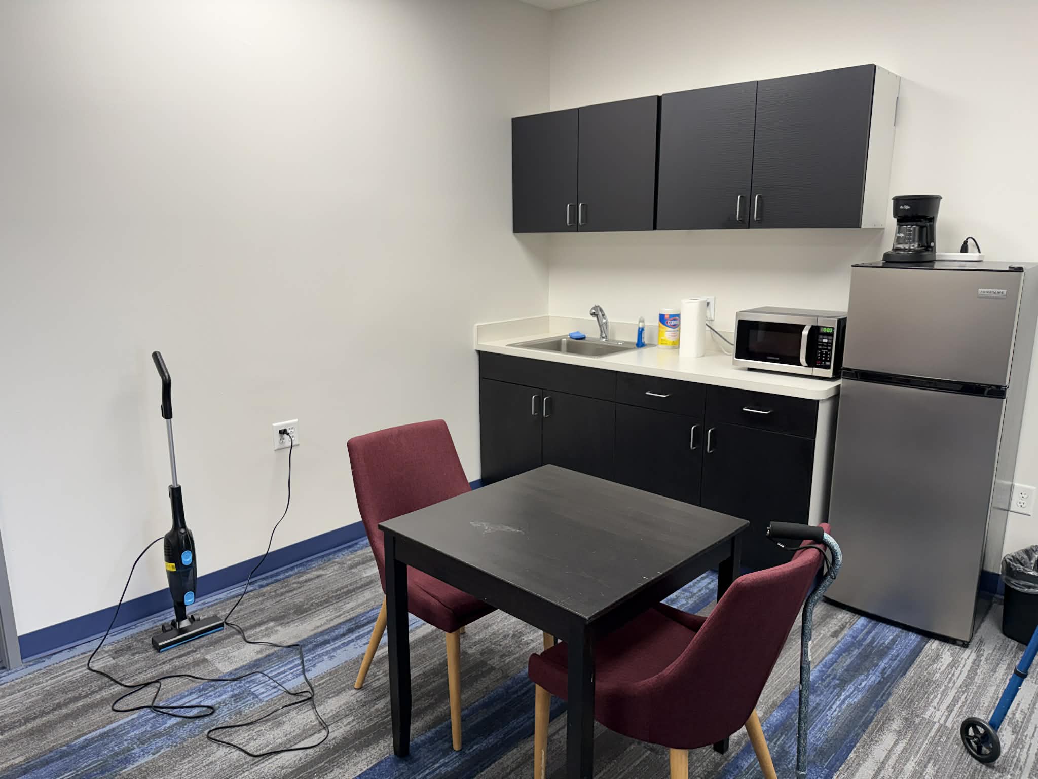 Fully equipped kitchenette similar to a senior's apartment.