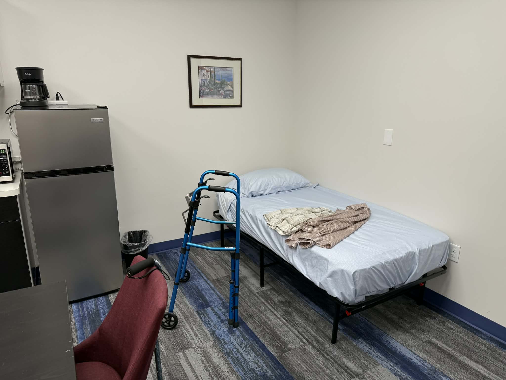 Senior apartment bedroom setup for hands-on training with tasks such as safe transfers and sit to stand.